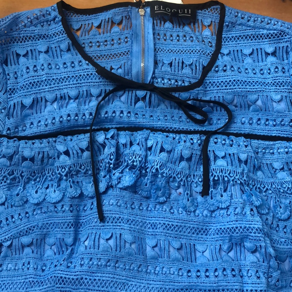 Blue dress with black trim and lace detail